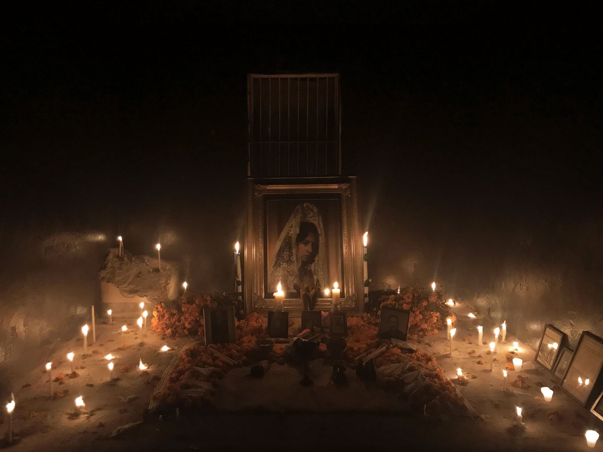 Ofrenda de Día de Muertos, candlelit altar, Herrera Building
