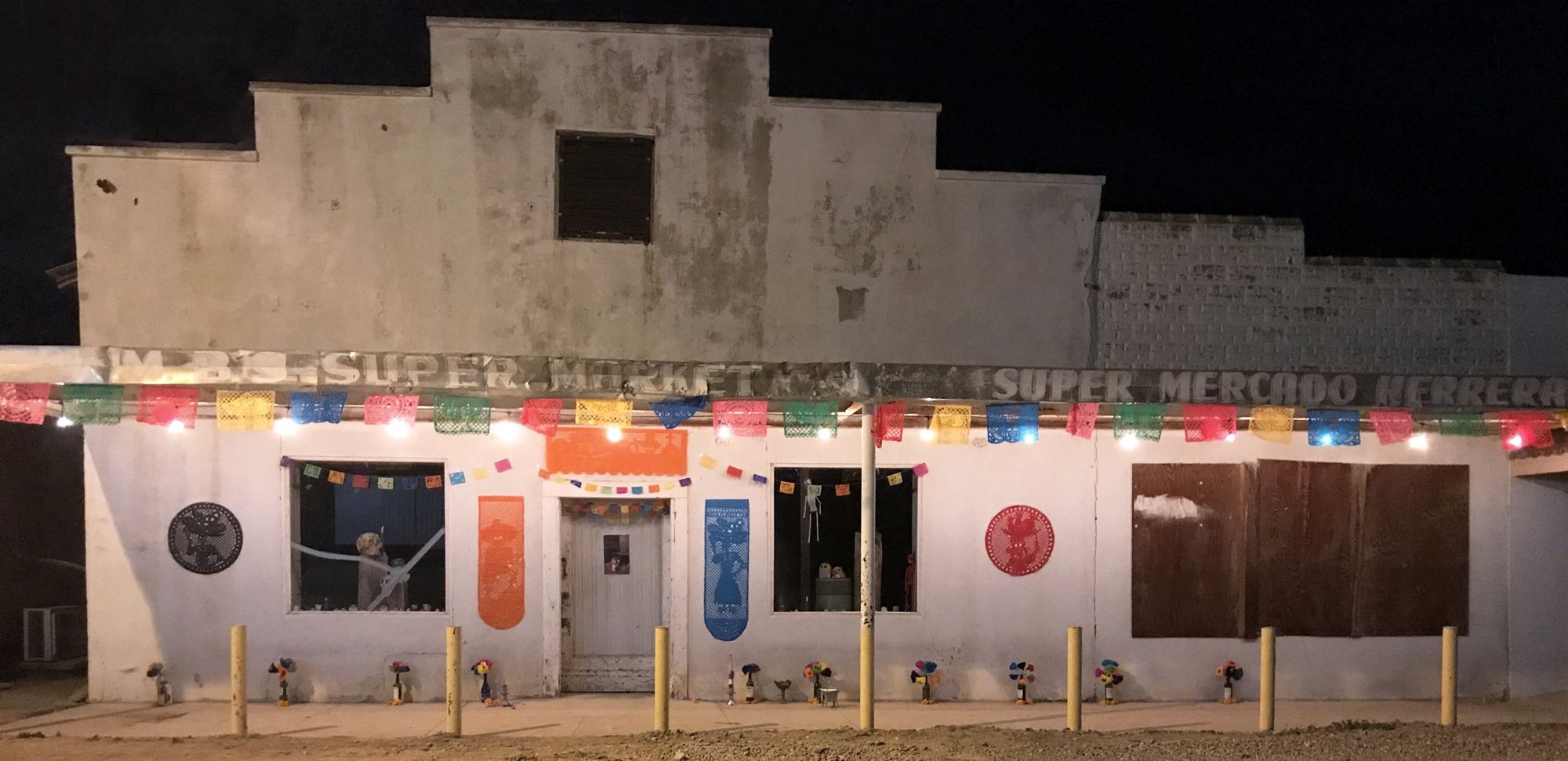 The Herrera Building at night during Día de Muertos